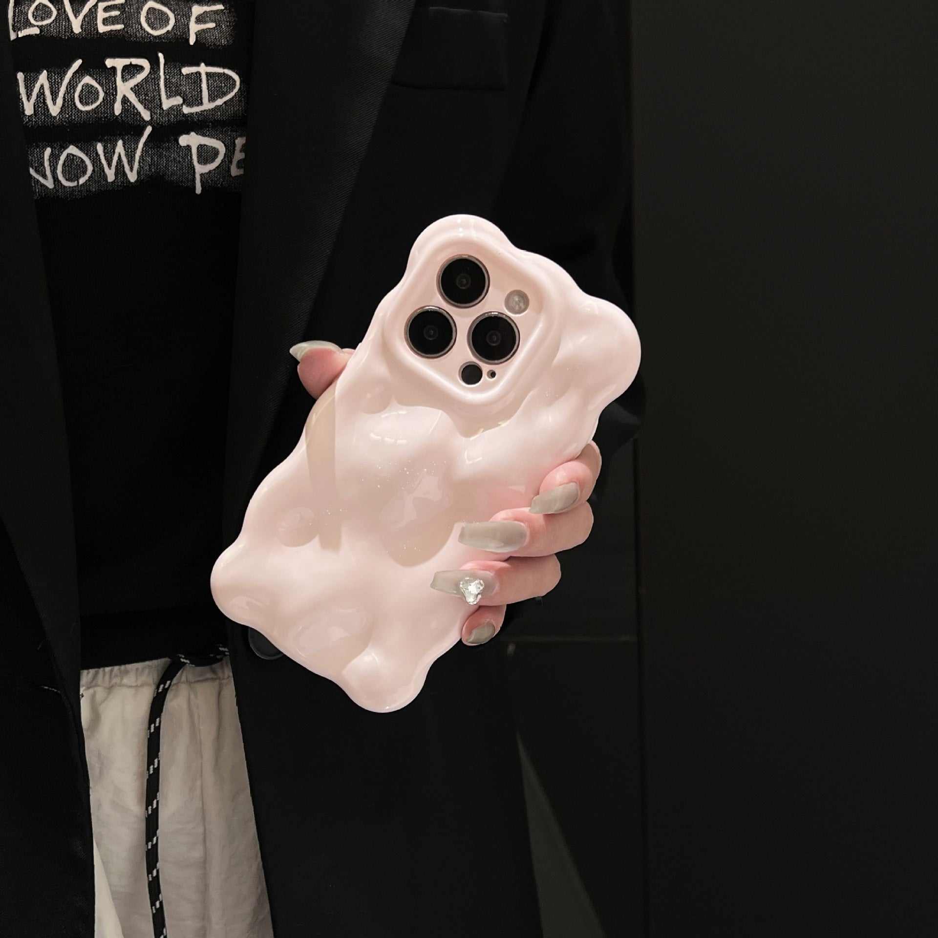 Light pink wavy bubble phone case for iPhone models offering fall protection.