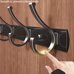 Aluminum over door hanger with multiple hooks, wall-mounted for organized storage.