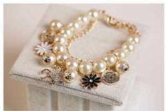 Elegant Pearl Flower Bracelet with delicate floral design and pearl beads.