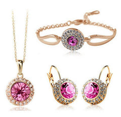Korean style jewelry set with pink stones, includes necklace, earrings, and bracelet.