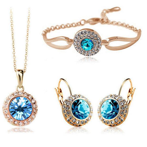 Korean style jewelry set with gold and blue diamond alloy necklace, bracelet, and earrings.
