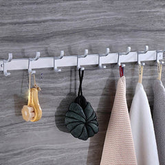 Punch free Bathroom white eight hooks with towels and accessories attached.