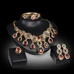 Jewelry Fashion Gems necklace and earrings set in 18K gold with rhinestones.