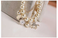 Pearl Flower Bracelet with floral design and elegant pearl beads.