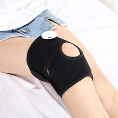 Anti-cold and warm leg joint massage knee pad on leg.