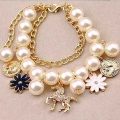 Elegant Pearl Flower Bracelet with floral and charm design.