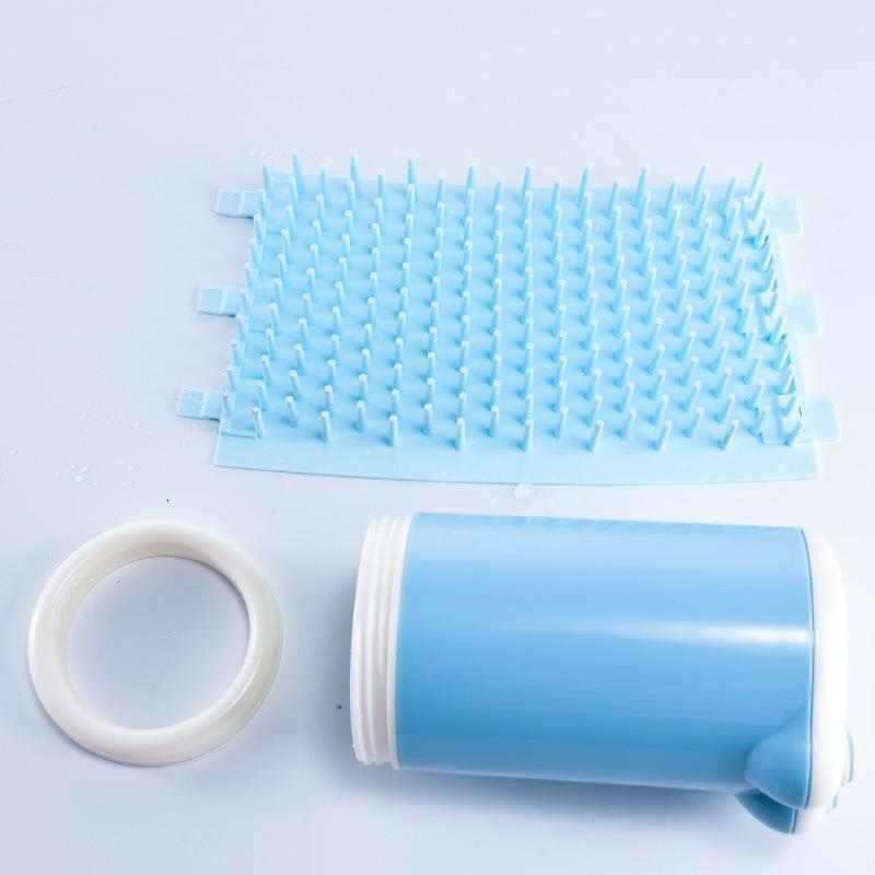 Portable dog paw cleaning cup with silicone bristles, blue, shown disassembled.