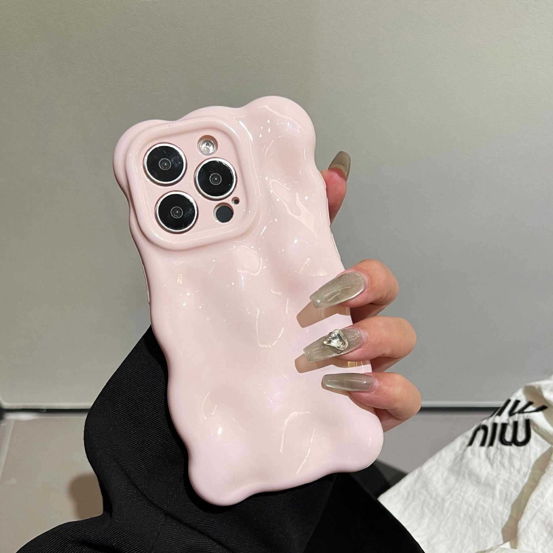 Light pink New Girl Phone Case with wave bubble design for iPhone models.