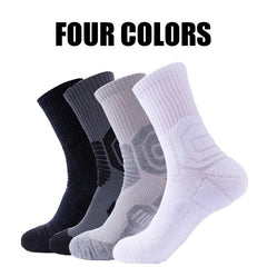 Four pairs of compression crew running socks in black, gray, and white, showcasing breathable and cushioned design, ideal for athletic activities.