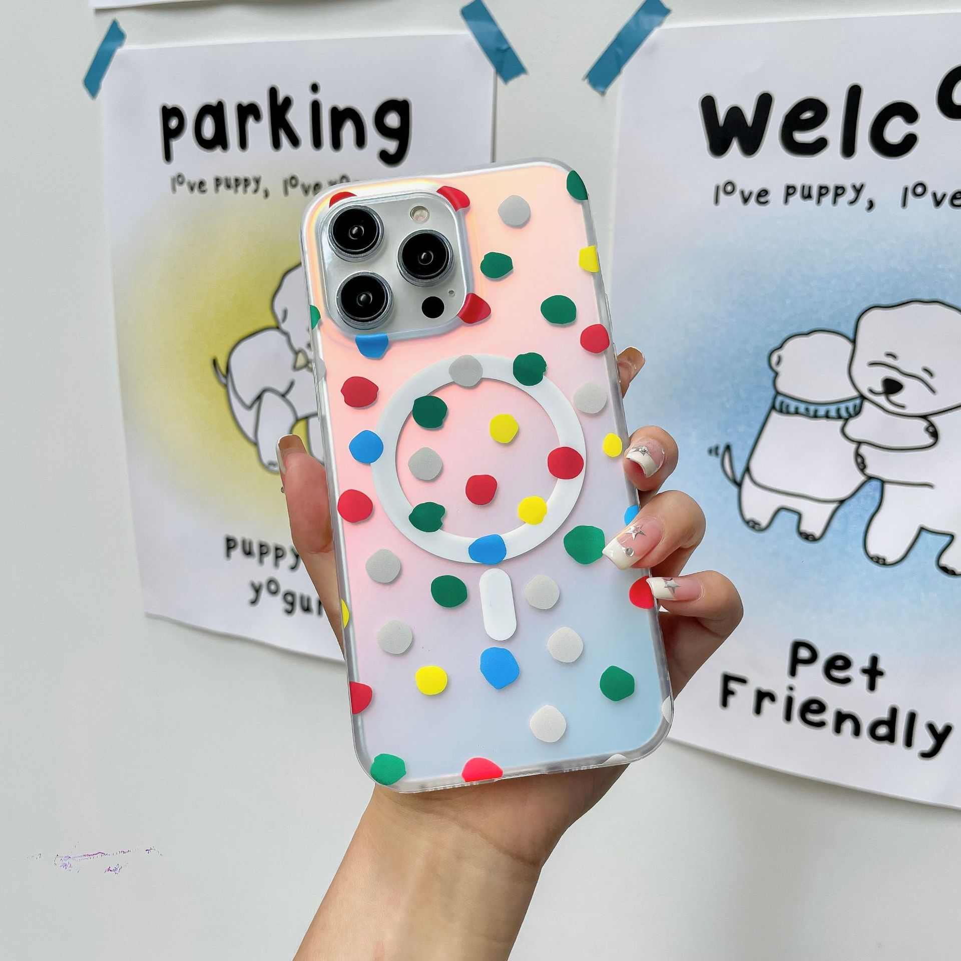 Colorful polka dot magnetic phone case with fall protection for iPhone models.