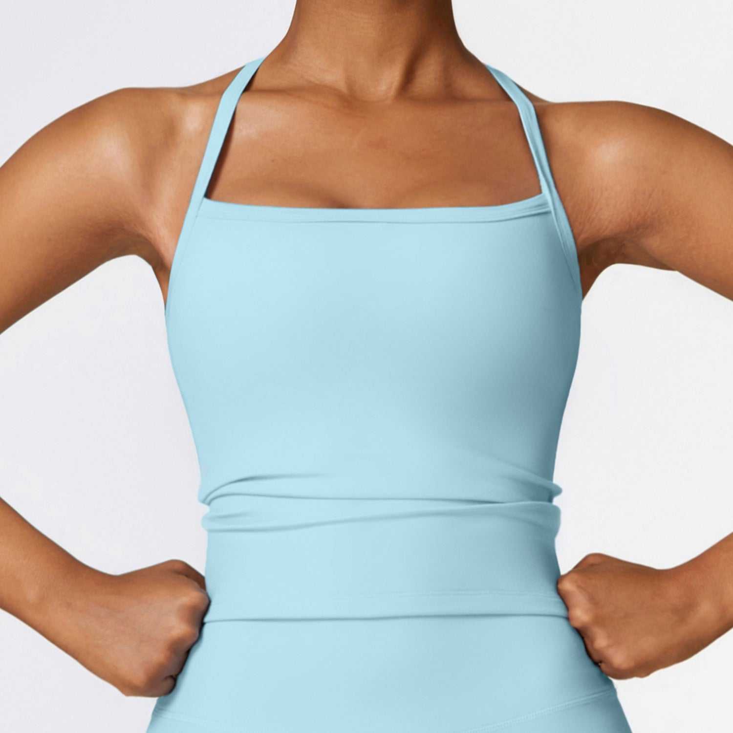 Women's sky blue beauty back yoga vest, quick-drying workout top with sleeveless design and abdominal length.