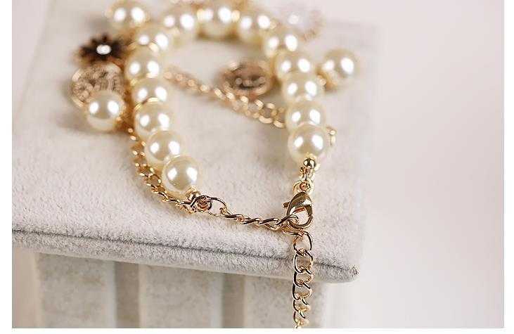 Elegant Pearl Flower Bracelet with floral design and delicate pearl beads.