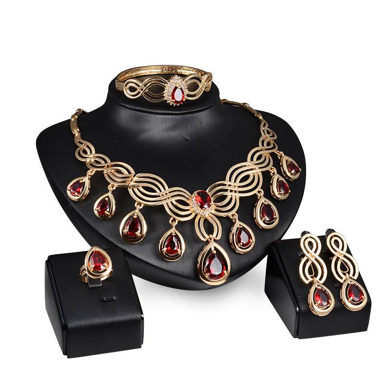 Jewelry Fashion Gems necklace and earrings set with red rhinestones and 18K gold finish.