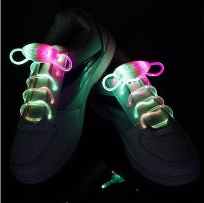 LED sport shoe laces glowing on sneakers, multi-color illumination.