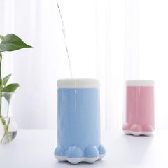 Portable dog paw washer with silicone bristles in blue and pink options.