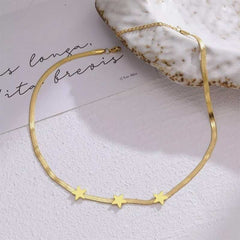 Gold stainless steel chain necklace with star-shaped titanium steel pendants.