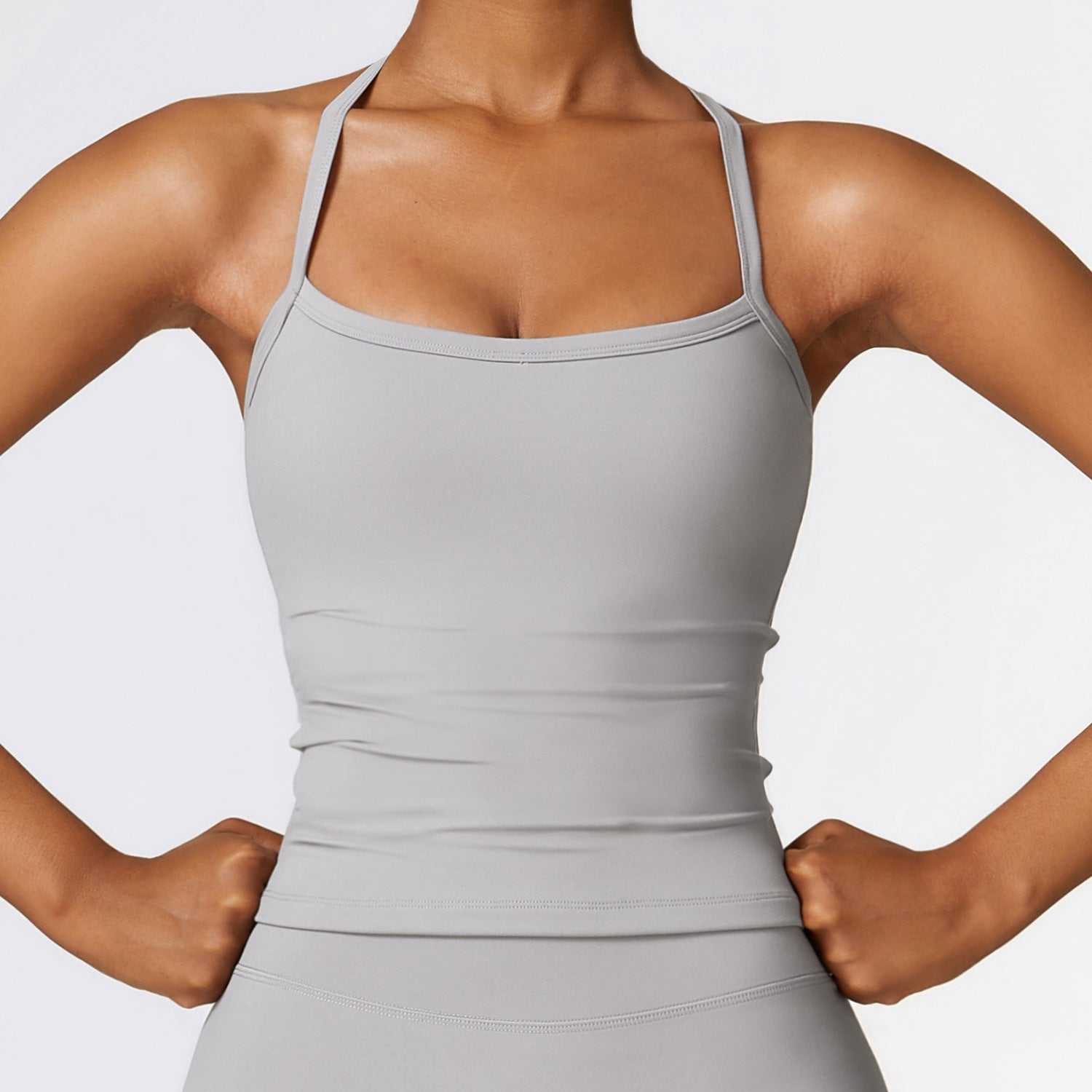 Woman wearing a Frost Gray Beauty Back Yoga Vest, sleeveless and quick-drying.