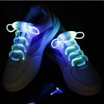 LED sport shoe laces glowing in dark athletic shoes.