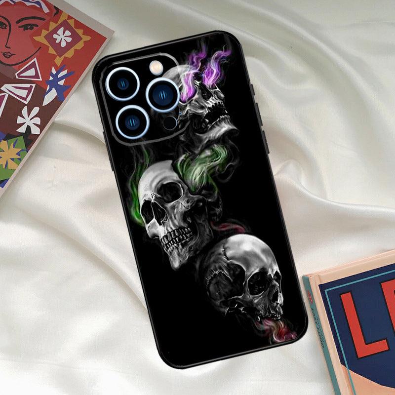 Cool ghost skull face phone case on bed, featuring vibrant colored smoke, designed for fall protection.
