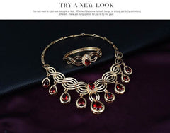 Jewelry Fashion Gems necklace and earrings set with gold alloy and red rhinestones displayed elegantly.